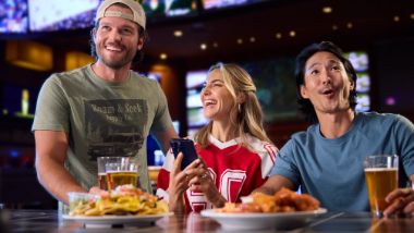 group ding at a sports bar