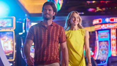 couple walking through casino